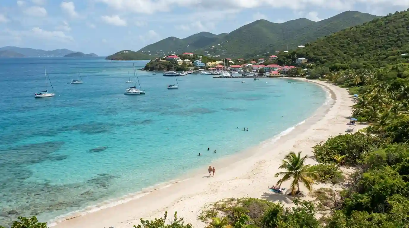 Tropical Caribbean beach and coastline in the US Virgin Islands with lush green hills and clear turquoise water