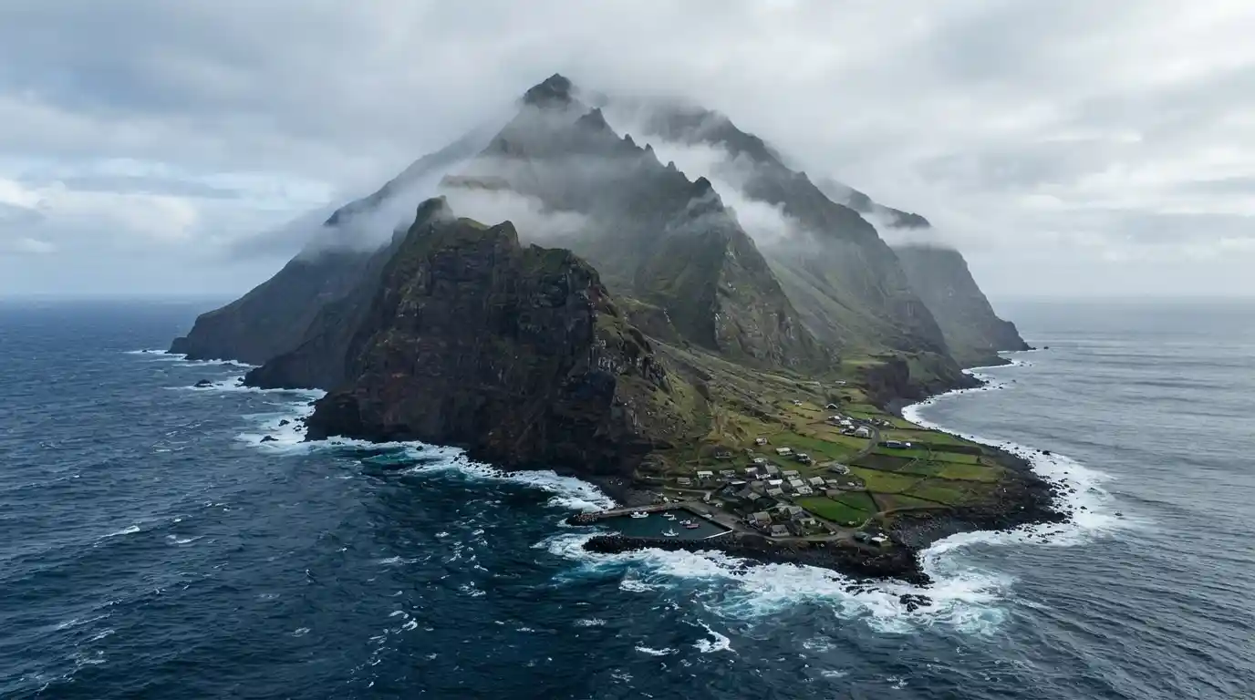 Tristan da Cunha rising above the South Atlantic Ocean with green volcanic slopes and rugged coastal cliffs.